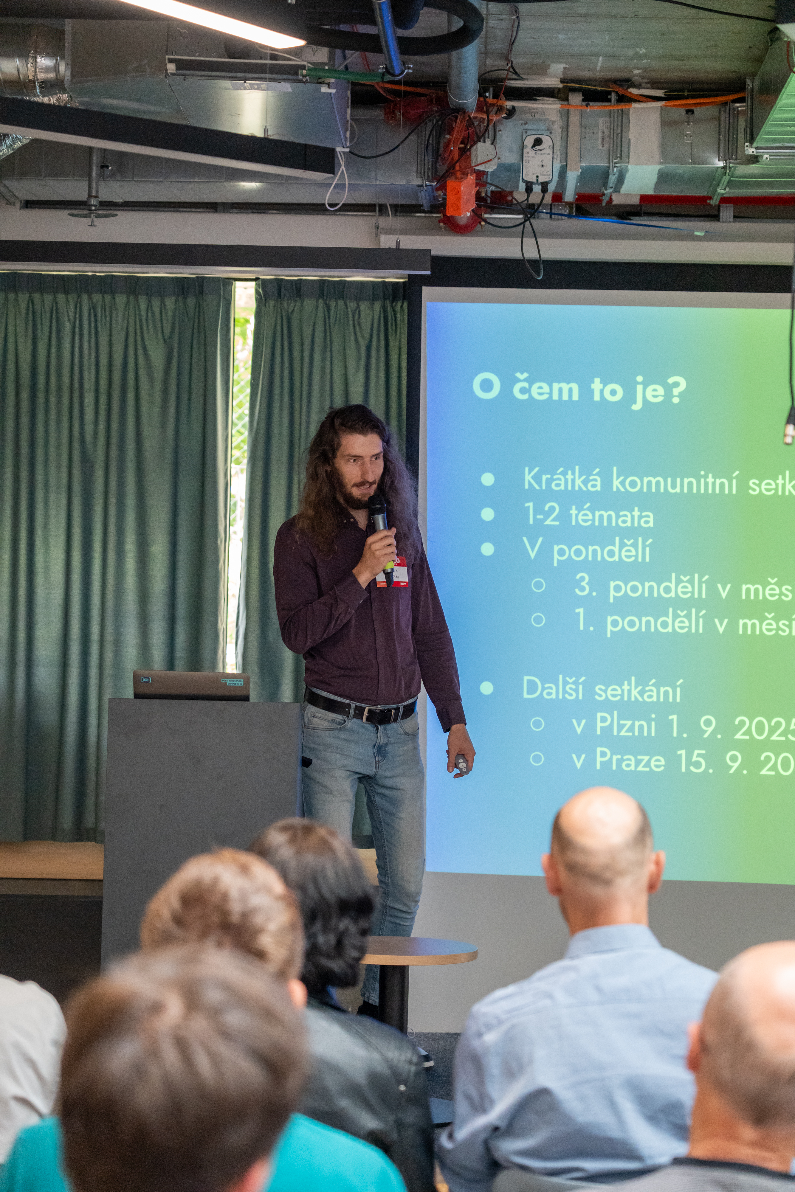 Jan Kulíšek presenting on stage